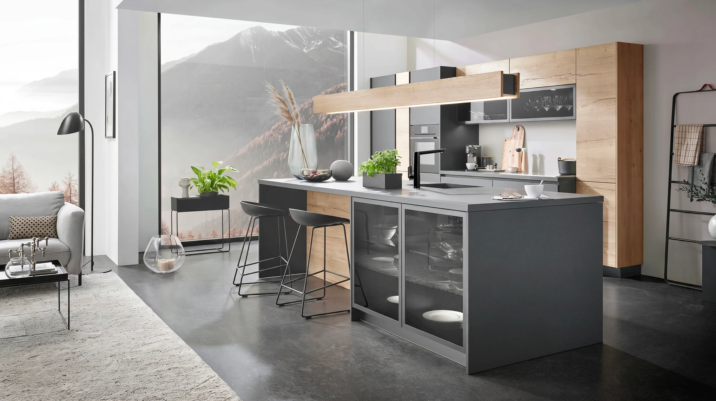 Cuisine moderne avec plan de travail en granit noir, crédence en carreaux de métro blancs avec joints noirs